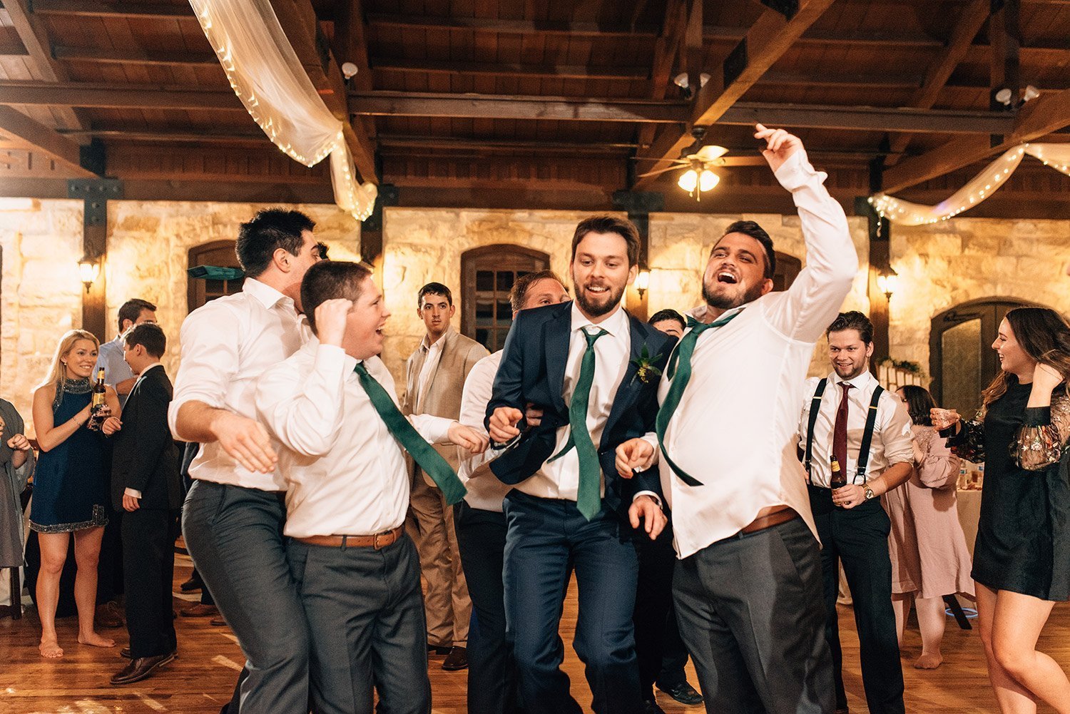 groomsmen dancing with groom at the springs event center