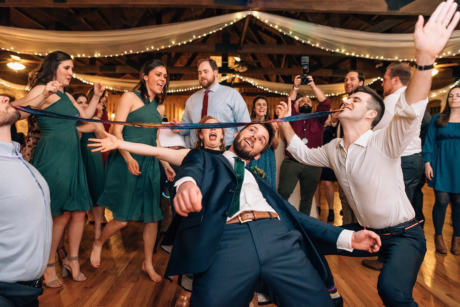 limbo on the dance floor at wedding reception