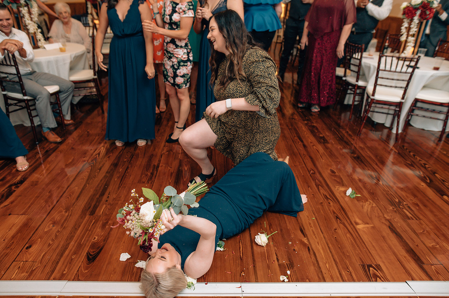 bridesmaid catches bouquet toss