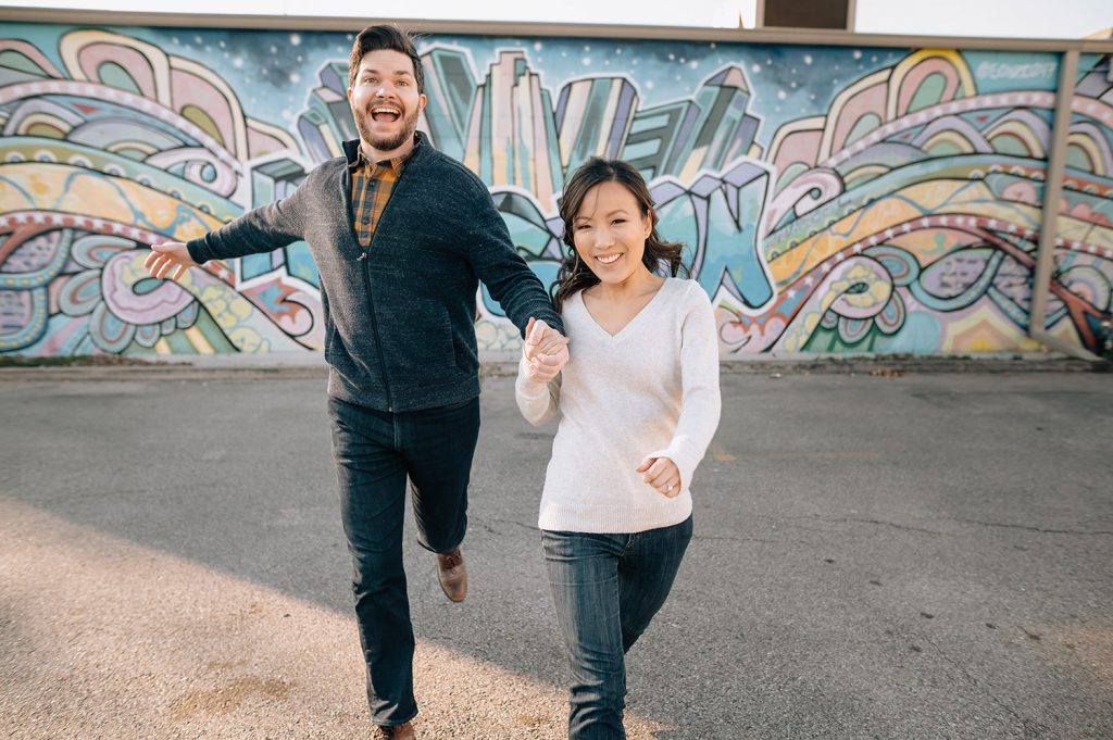 Houston Engagement Photo in front of houston mural