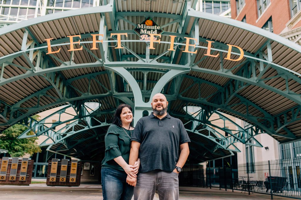couple outside Minute Maid Park for their Houston Engagement photos